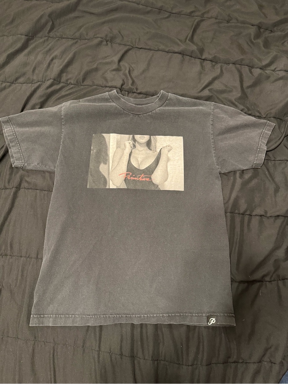 Primitive Black Graphic Tee with Subtle Red Script